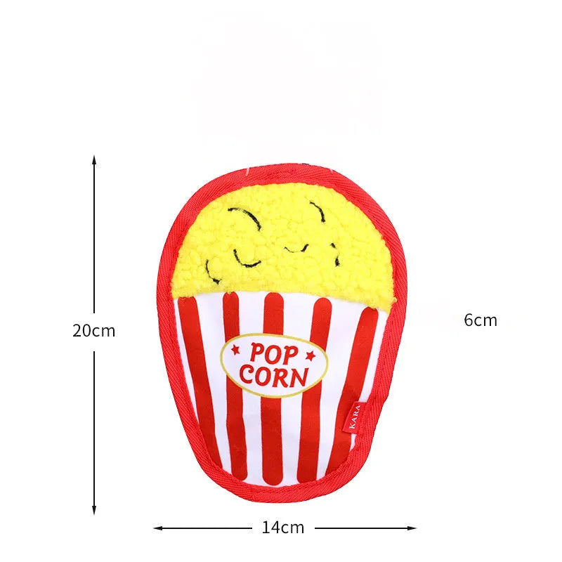 Colourful crinkle and squeak dog toy in a fast-food burger shape on a white background.