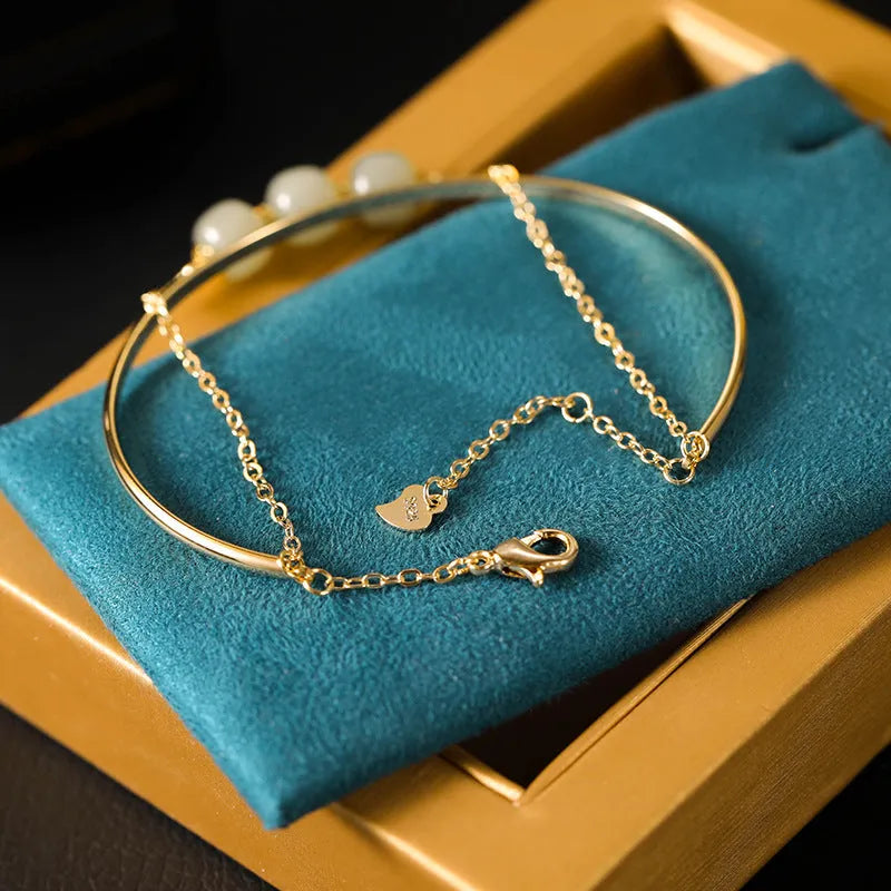 Women's jade lucky beads bracelet with gold inlay design in single, double, and three bead versions