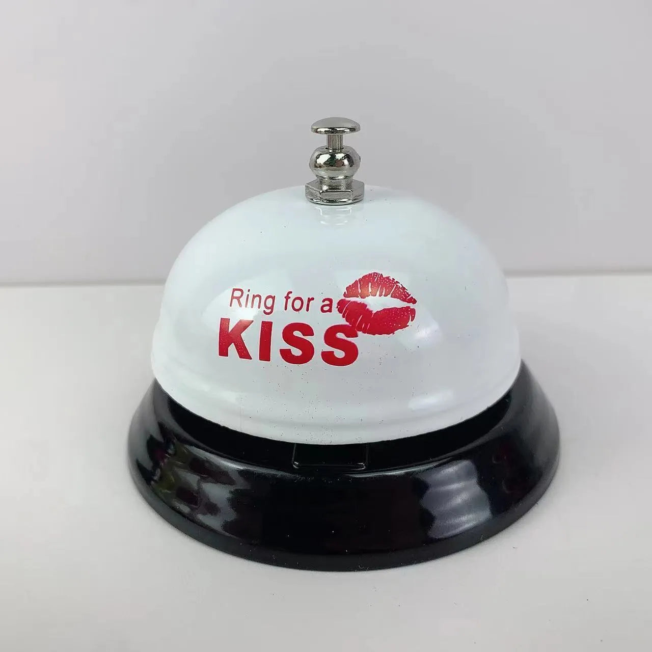 Iron game bell in assorted colours including red, blue, green, pink, and yellow for service or classroom use.