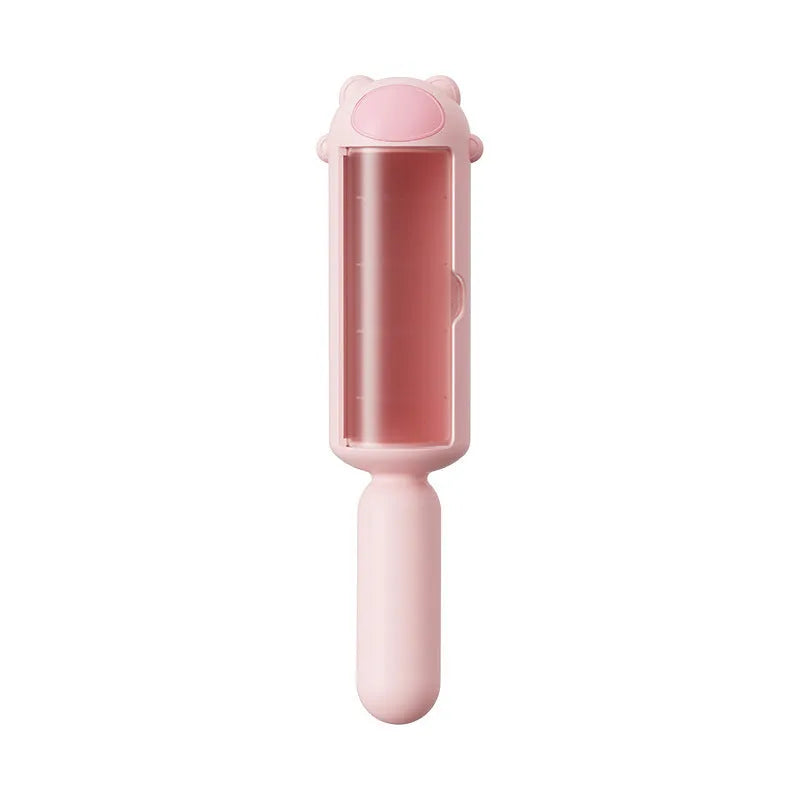 Blue reusable pet hair remover tool with self-cleaning base on a carpet.