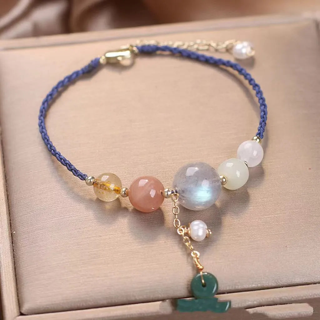 Hand-woven women's crystal bracelet with peace buckle clasp and sequin accents