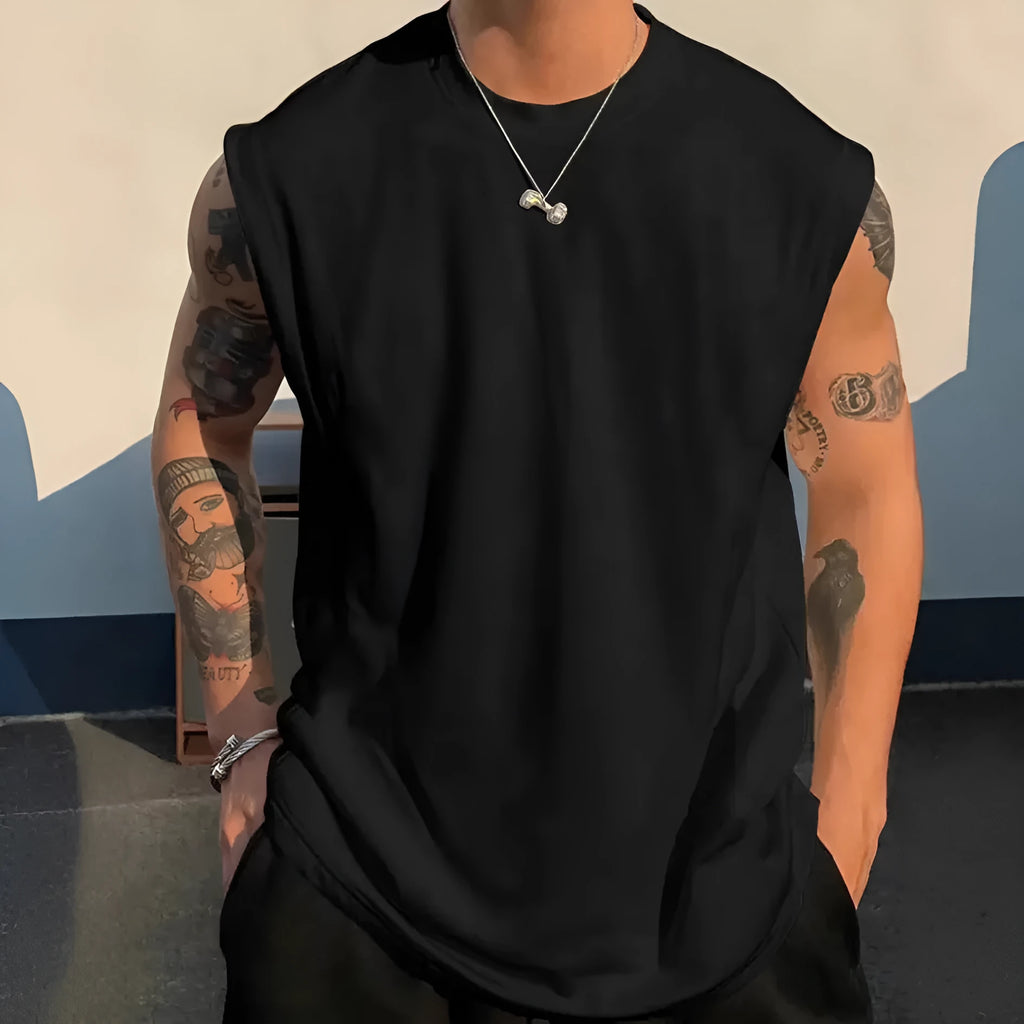 Men's loose solid colour cotton tank top on a hanger, showing straight hem and sleeveless design.
