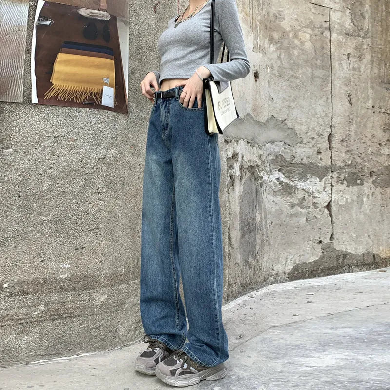 Women's high-waist retro blue straight-leg jeans on a hanger, showing the classic fit.