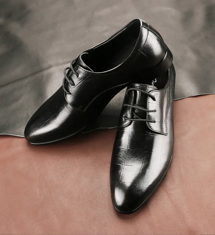 Men's black leather derby shoes with checkered pattern and pointed toe design on rubber soles