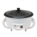White oblate home coffee bean roasting machine with 750g capacity on a kitchen counter