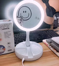 White foldable acrylic vanity mirror with LED lights and USB charging port
