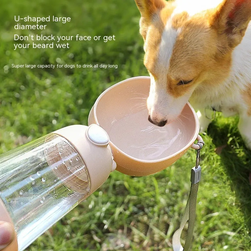 Portable dog water bottle and food container in yellow, pink, and brown for outdoor travel