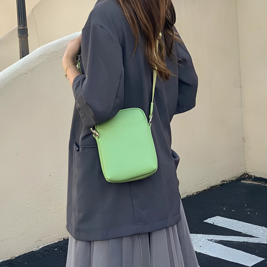 Solid colour PU leather crossbody phone bag in beige, shown with adjustable strap.