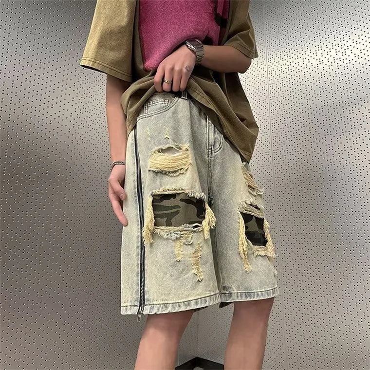 Men's yellow mud camouflage denim shorts with ripped detailing and straight leg cut