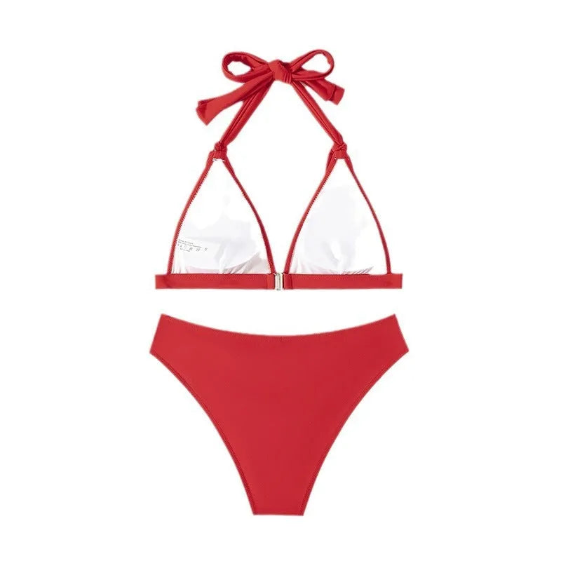 Red women's lace-up halterneck bikini set with matching shorts