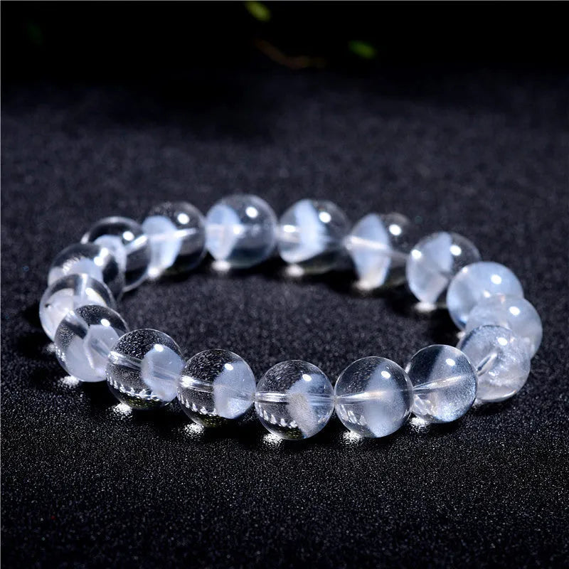 Women's original white crystal pyramid bracelet with ruyi charm, showing polished beads.