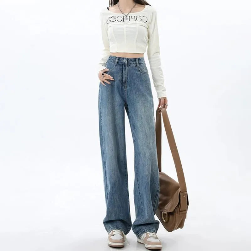 Woman wearing retro blue high-waisted wide-leg denim jeans with a straight-leg cut.