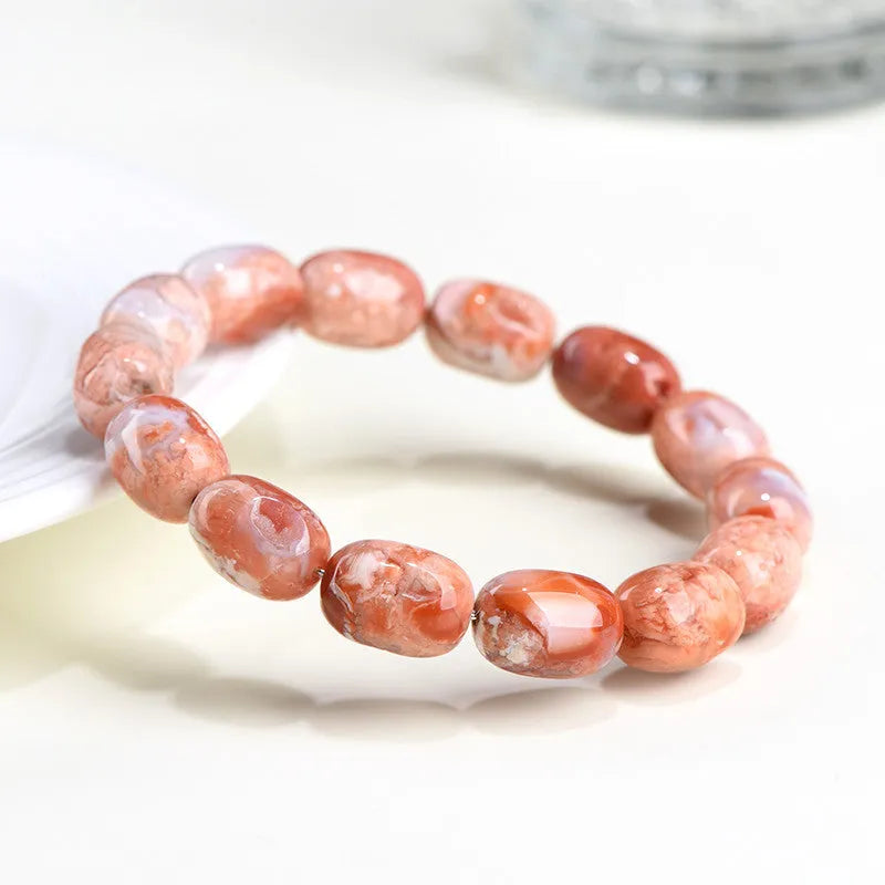 Natural cherry agate bracelet with 10x14mm barrel beads in geometric design