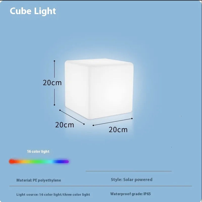Modern square LED cube light stool in a garden setting, showcasing its clean design and luminous top.