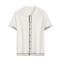 White short sleeve cardigan with dark contrast colour lapels, laid flat to show relaxed fit and button front.