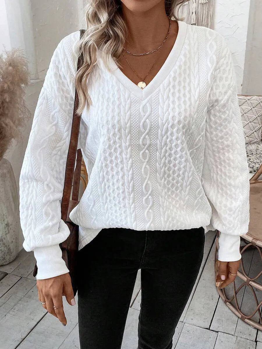 Milky white loose long sleeve T-shirt with a textured 3D pattern on the front.