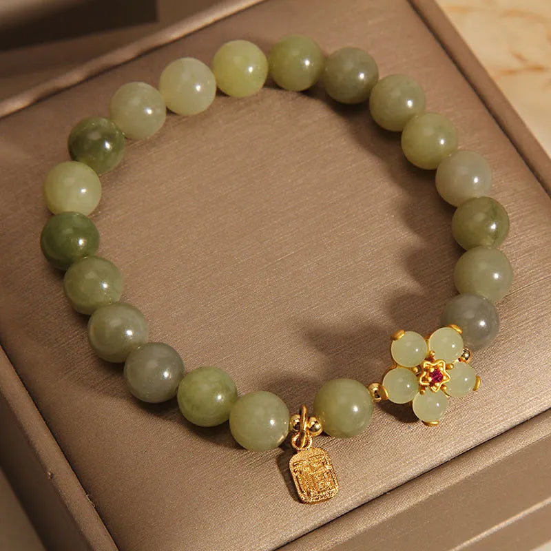 Women's casual fashion bracelet in a grey jade colour with alloy metal construction.