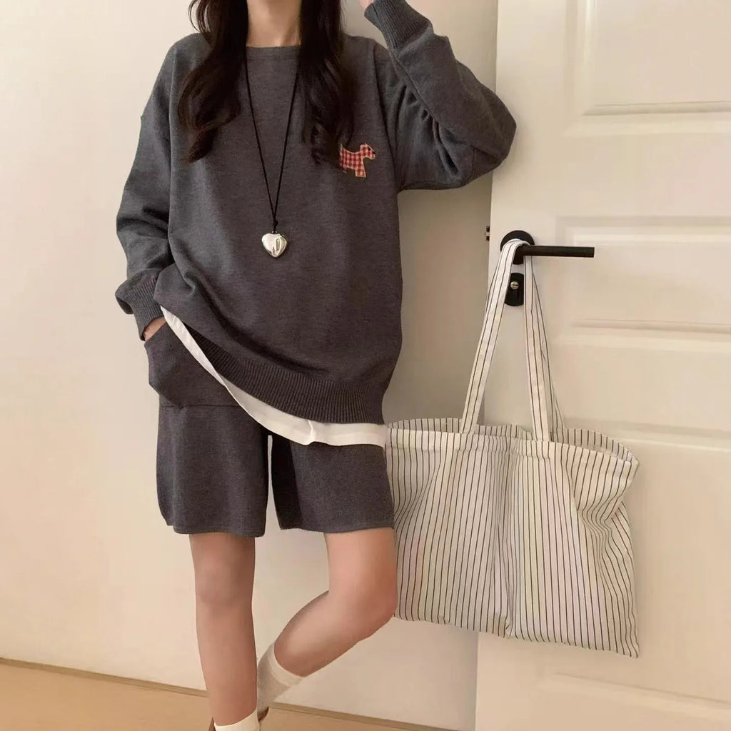 Women's milk blue knitted sweater and shorts suit with embroidered animal pattern.