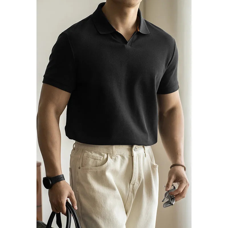 Blue short-sleeved polo shirt on a hanger, showing regular fit and cotton-polyester fabric blend.