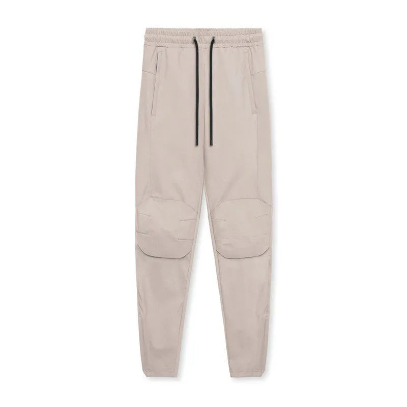 Men's grey ankle-tied loose fitness running trousers on a hanger.