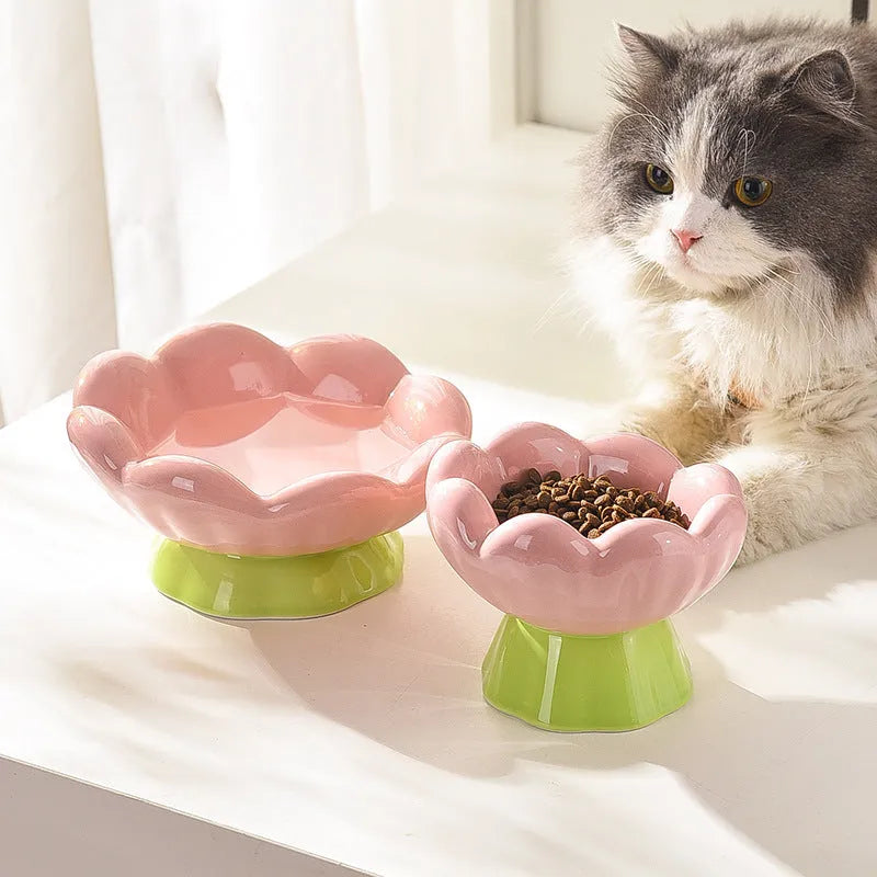 Pink ceramic raised cat bowl with flower shape and non-slip base, 15-degree angle, for small to medium cats