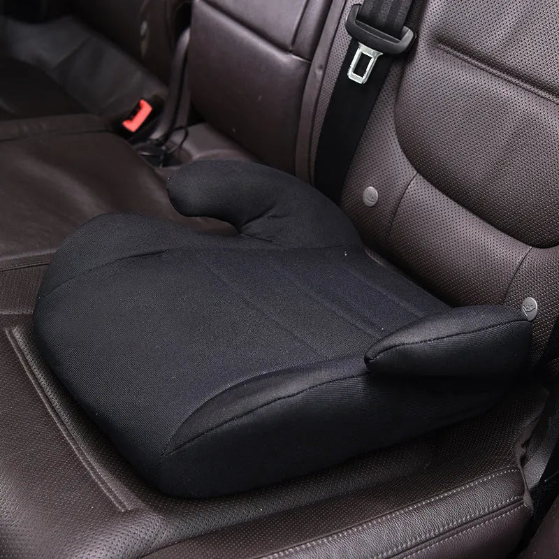 Portable children's car seat in knitted cotton and plastic for ages 3 to 12, shown in one of nine colour options