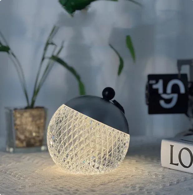 Small cylindrical portable LED night lamp with a touch dimmer in a choice of five colours.