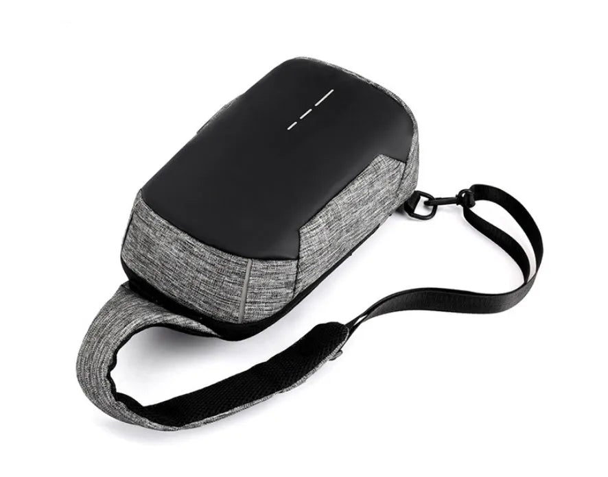 Dark blue Oxford cloth chest bag with zipper and adjustable strap, shown front-on.