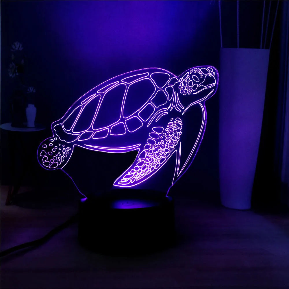 3D clear acrylic turtle-shaped LED night light with multi-coloured illumination.