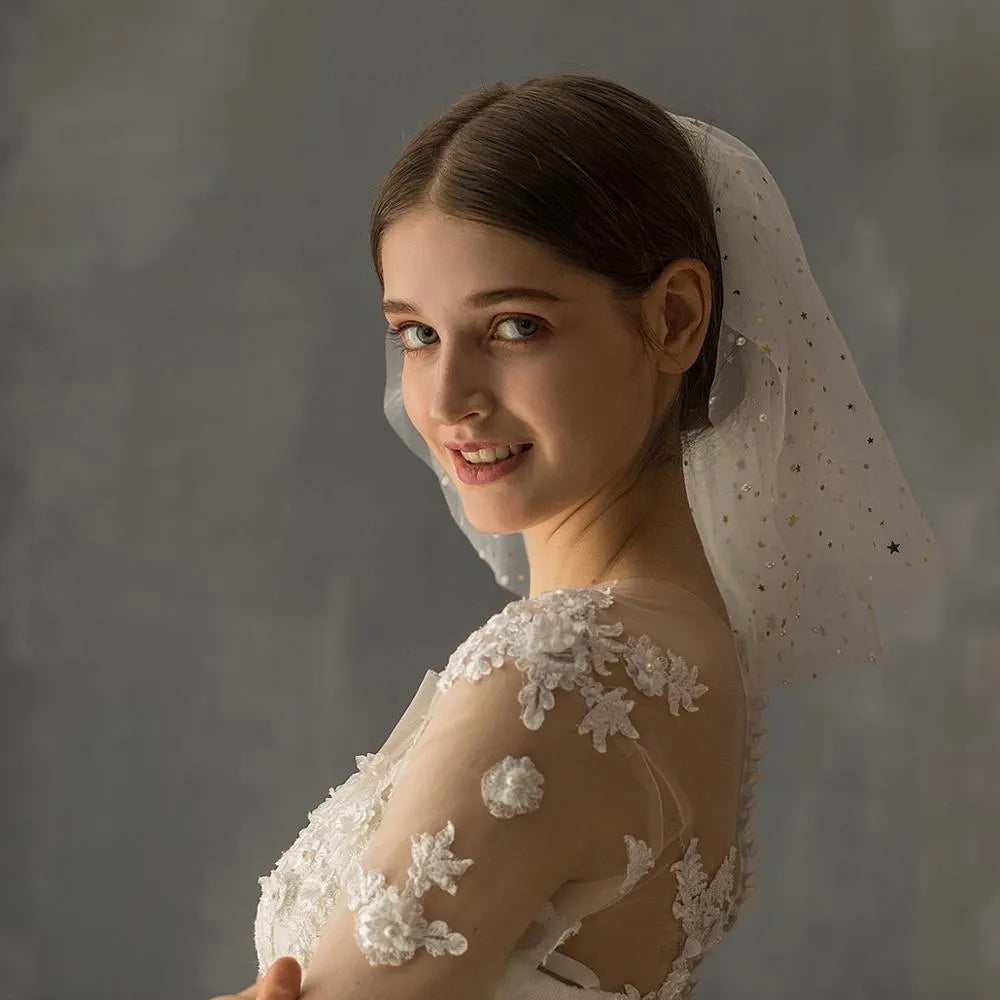 White yarn bridal multi-layer short veil with hair comb on a neutral background