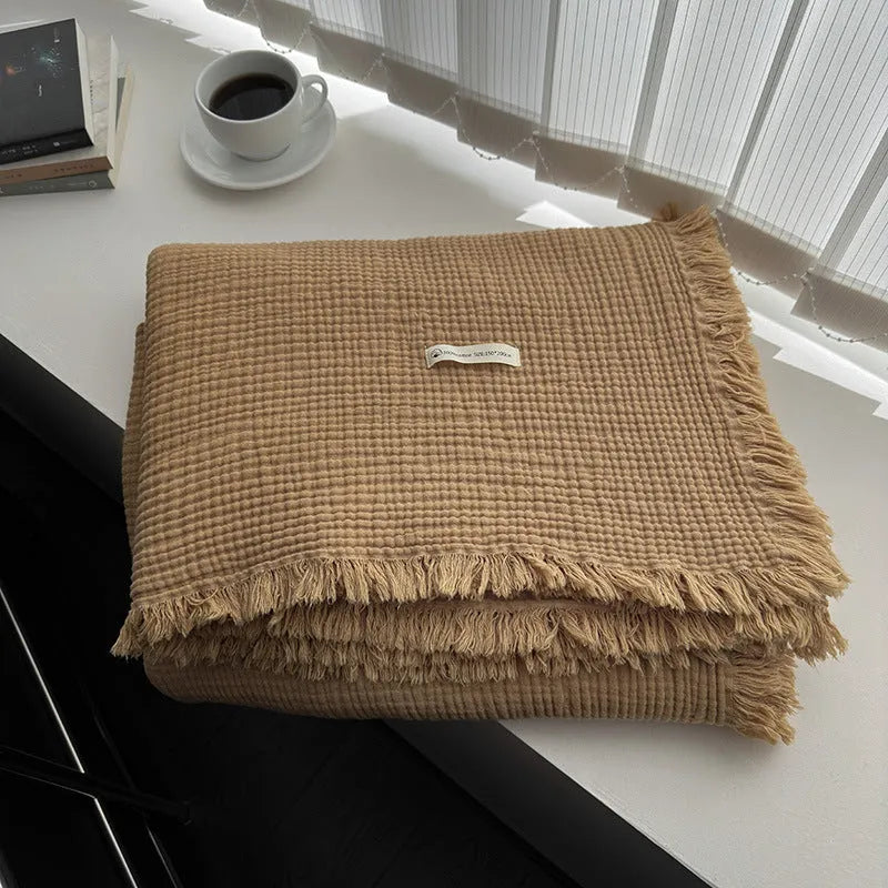 Four-layer cotton gauze blanket with tassel trim in navy blue colour