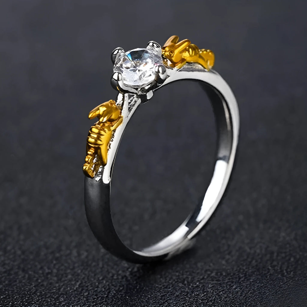 Close-up of a black gold finished copper ring with a detailed 1.5cm tall crown model on a person's finger.