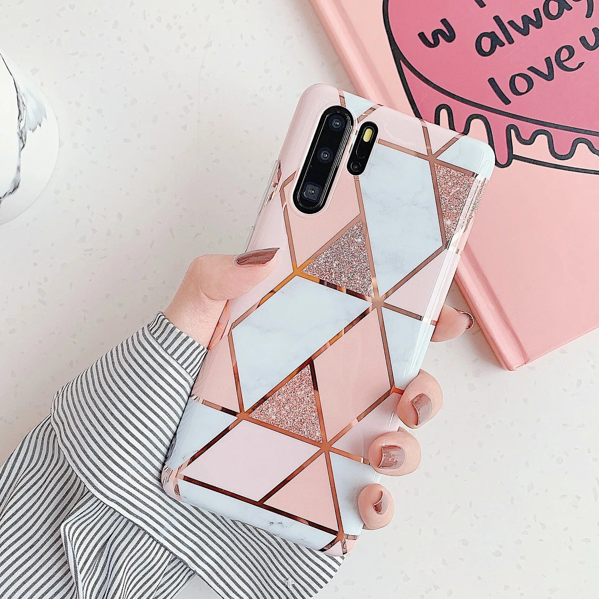 Electroplated marble pattern TPU back cover case for a Huawei or Samsung smartphone.