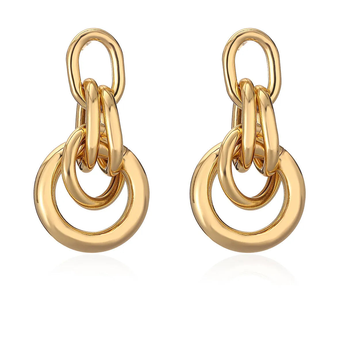 Gold geometric drop earrings with irregular design elements on copper base