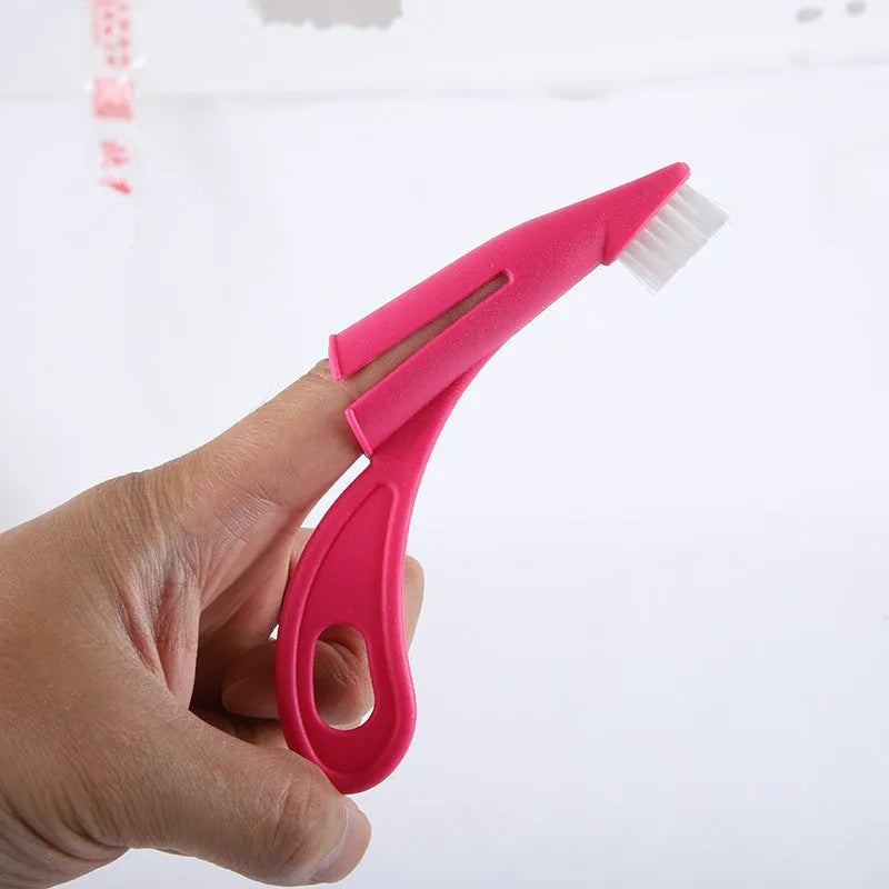 Red and white pet finger toothbrush for dogs and cats with silicone bristles and finger-sleeve design