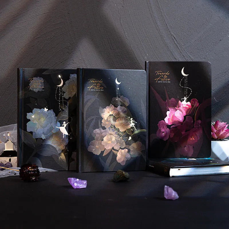 A5 notebook with luminous reflective cover open to show pages with colourful illustrated backgrounds.