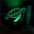 3D clear acrylic turtle-shaped LED night light with multi-coloured illumination.
