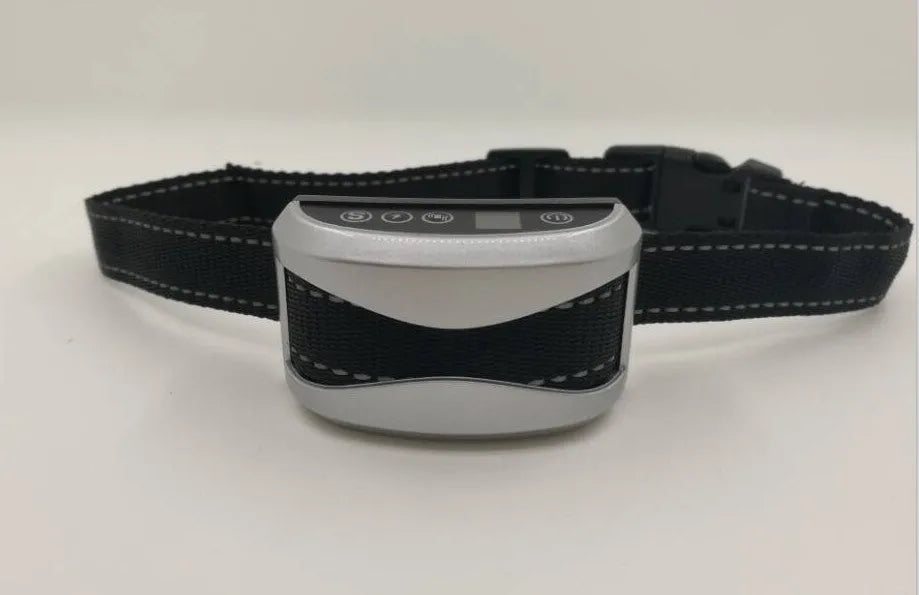 Black dog bark training collar with digital display, adjustable strap, and micro-USB charger.