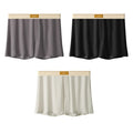 Men's solid colour ice silk underwear with a loose fit and mid waistband on a neutral background.
