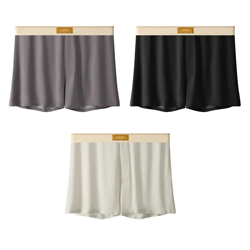 Men's solid colour ice silk underwear with a loose fit and mid waistband on a neutral background.