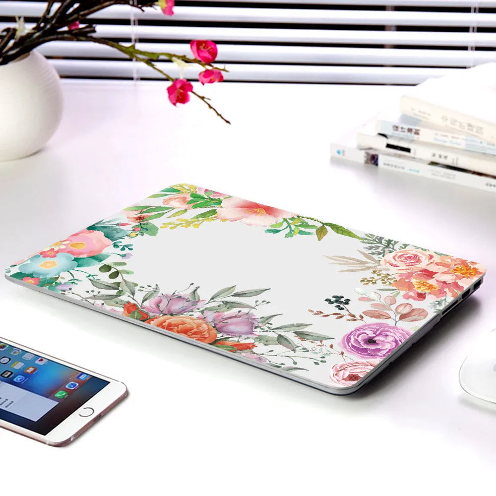 Plastic laptop protective shell with a floral pattern design for MacBook Air and MacBook Pro models.
