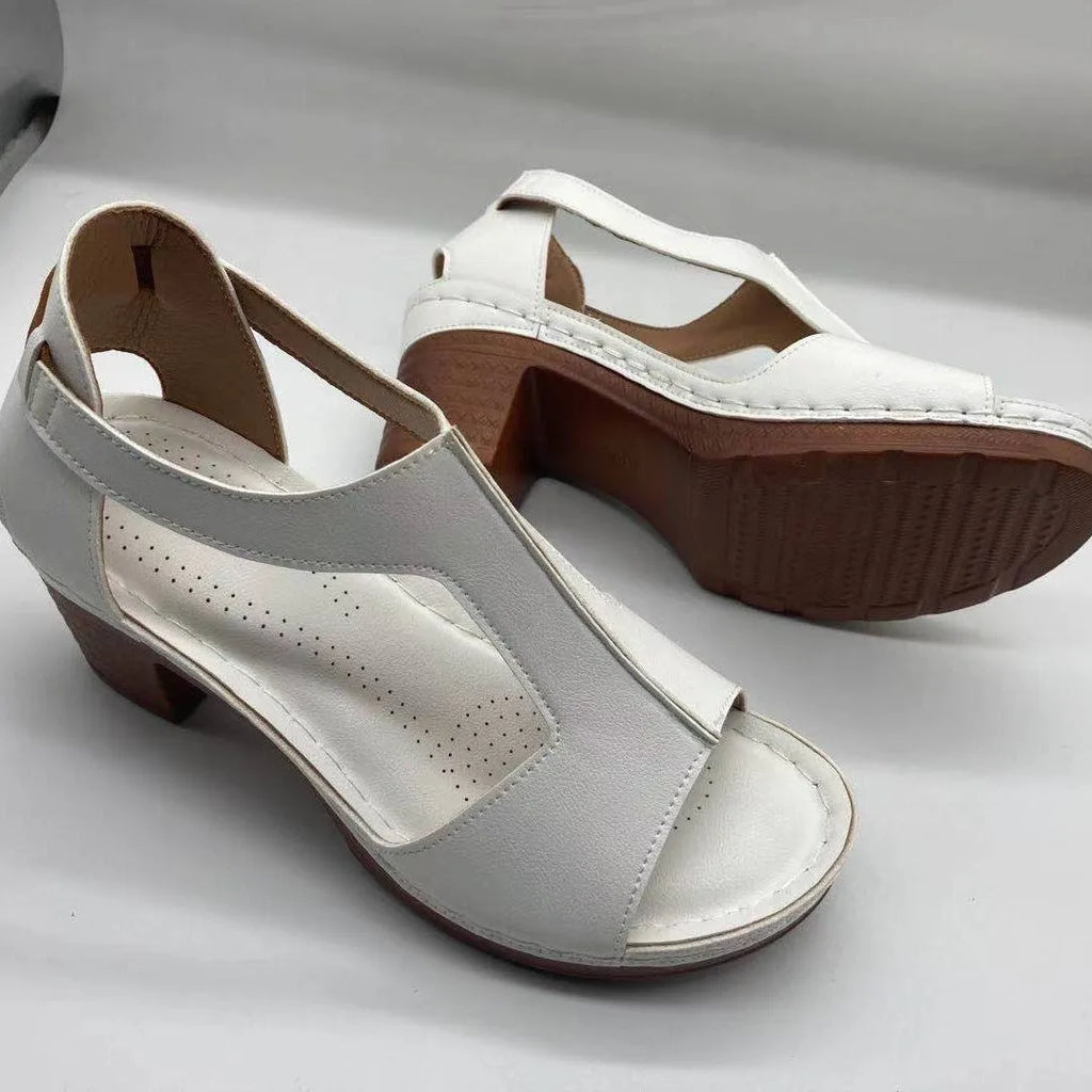 Women's peep toe wedge sandal with buckle on low heel, open fish mouth toe, in light brown