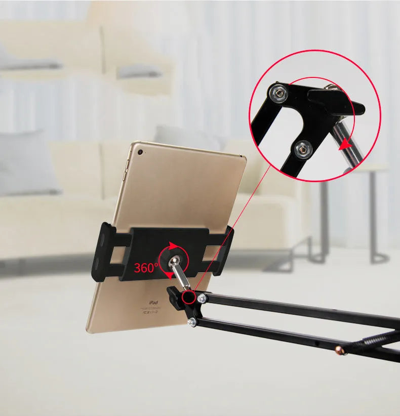 Adjustable black phone and tablet stand with 10cm base on a wooden desk