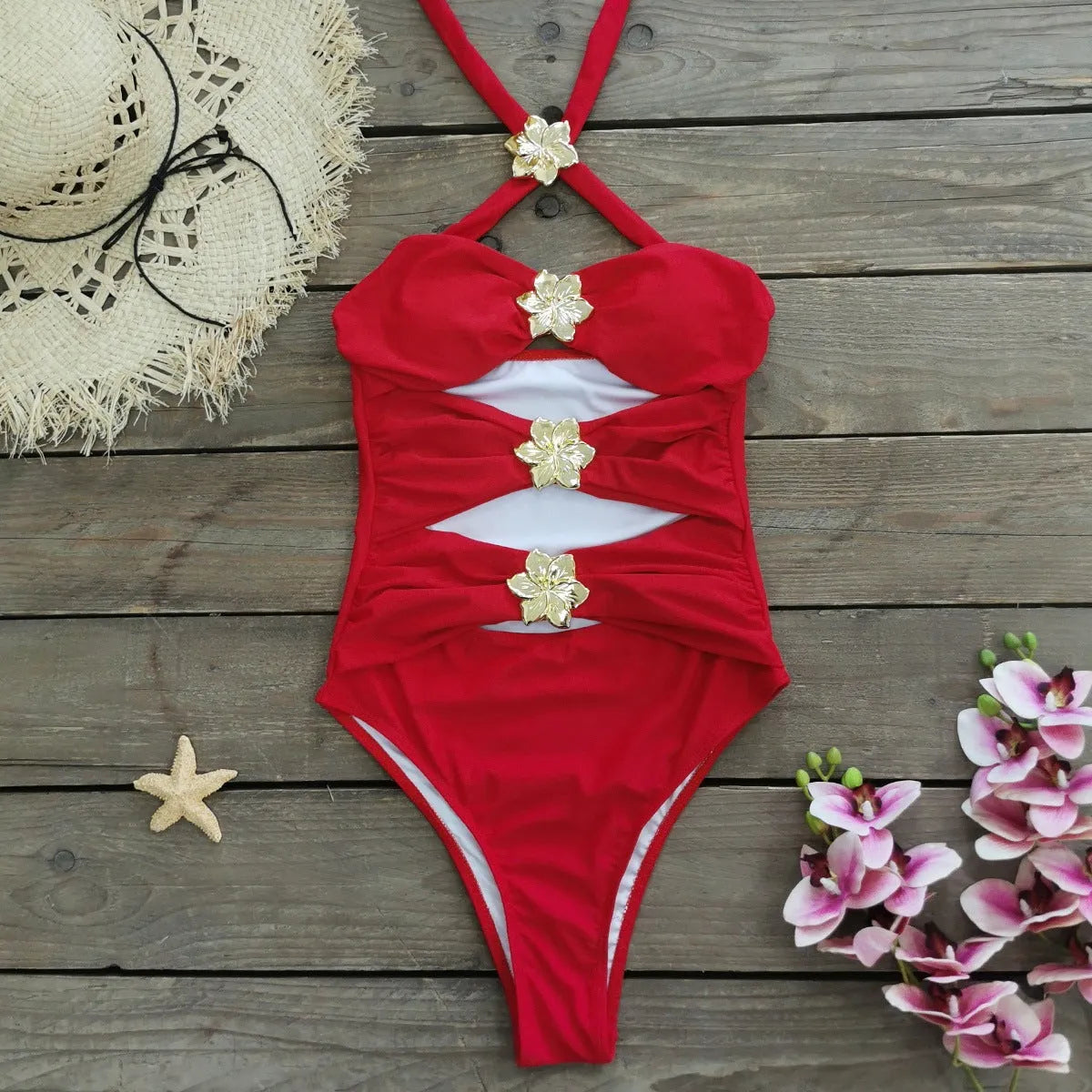 Women's solid colour one-piece swimsuit with hollow-out tube top and matching short skirt on hanger.