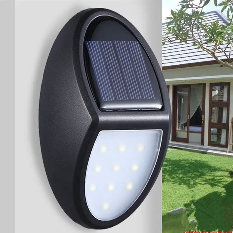 Black rectangular solar wall light with solar panel and LED illumination for outdoor use