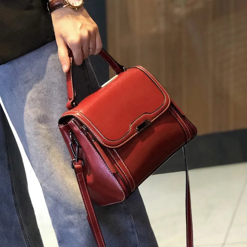 Genuine leather women's vintage messenger bag with multiple internal compartments in caramel colour