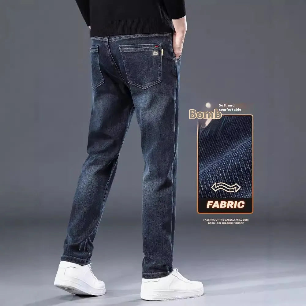 Man wearing blue-grey slim straight loose fit casual trousers with a micro-elastic waist.