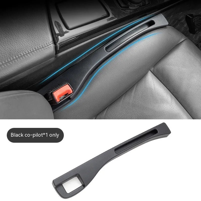 Black plastic car seat gap storage organiser box with handle between vehicle seats