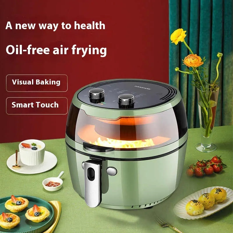 White air fryer oven with clear viewing window on door and mechanical dial controls on front.