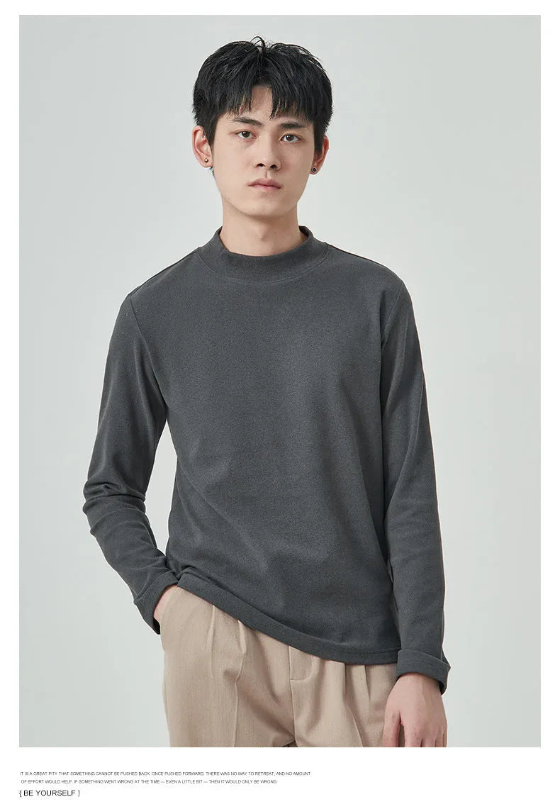 Man wearing a brown Dralon half-high collar long sleeve t-shirt for casual autumn wear.